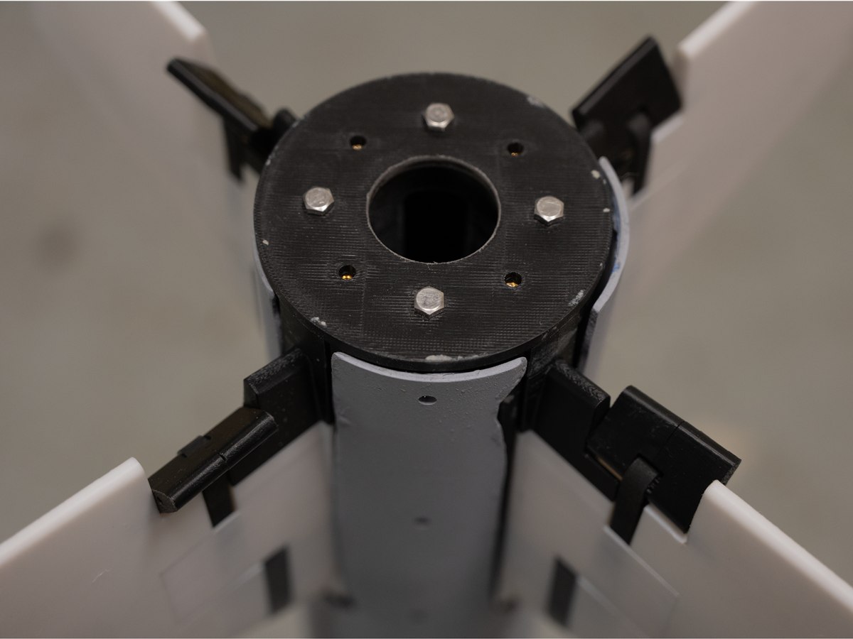 Close-up of the fin-tab actuation hub on Moonfall